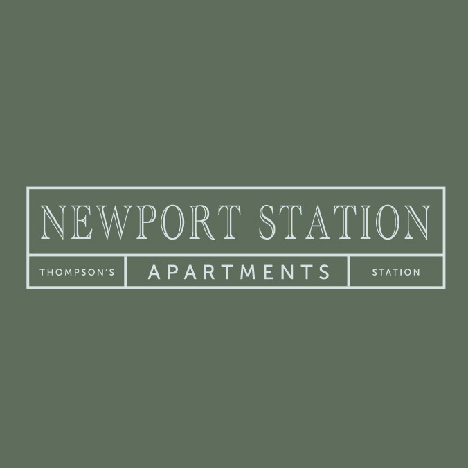 A sign that says Newport Station Thompson